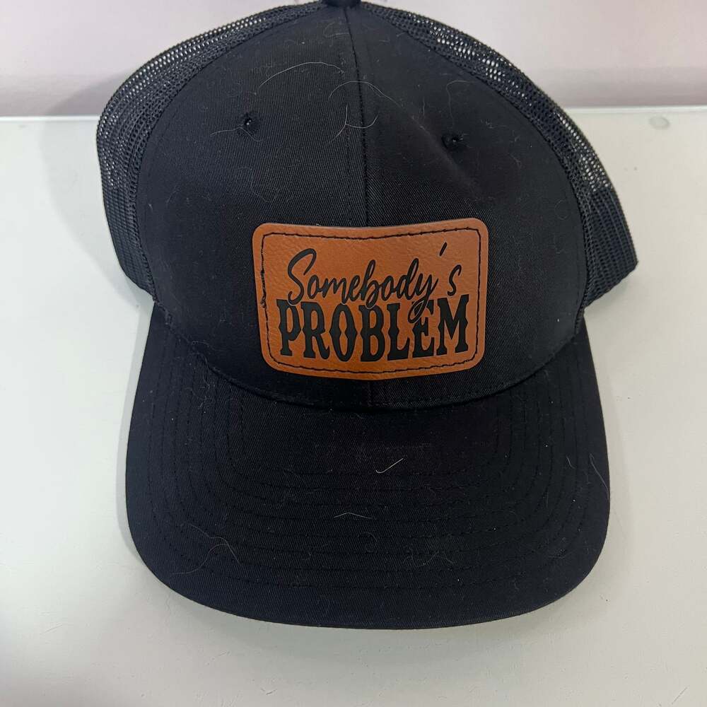 Somebody's Problem Trucker Hat with Leather Patch
